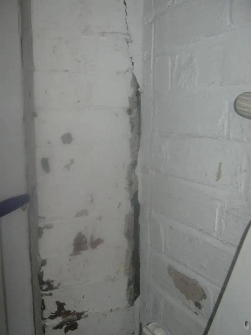 THE LOWER HALF OF THE CRACK NEAR BACK DOOR