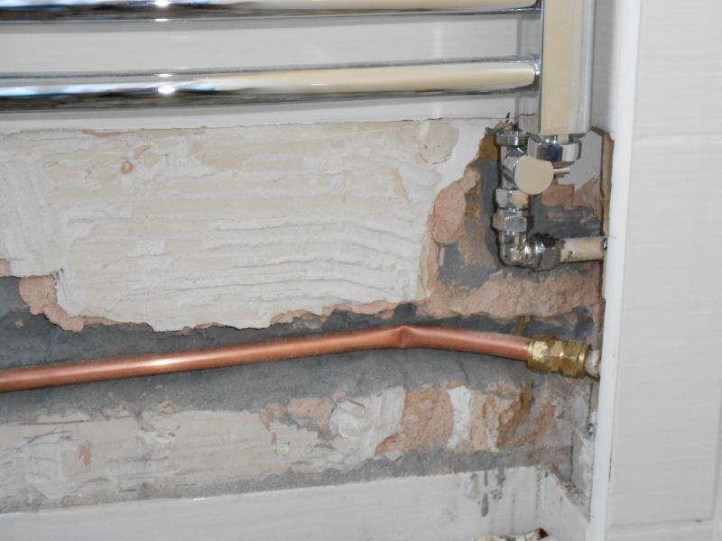 Tiles removed and chased the wall.