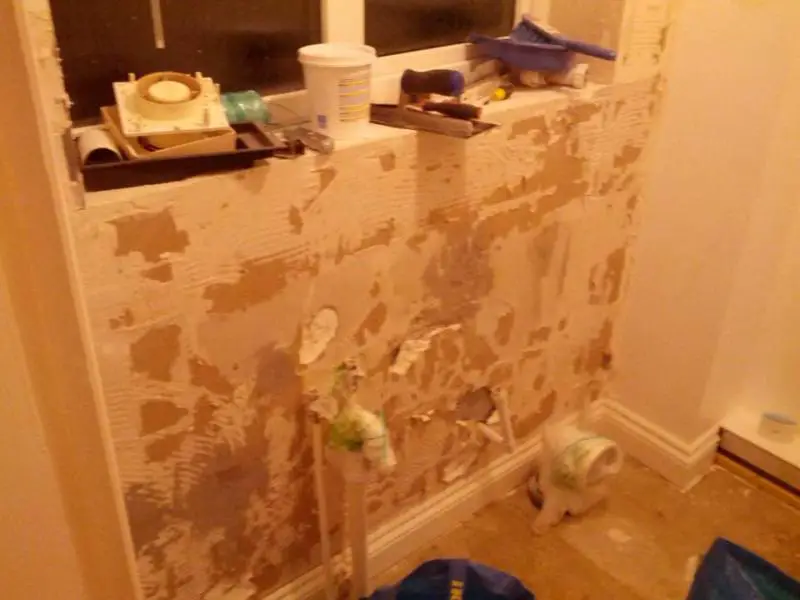 Do i need to treat these walls before applying tile backing board? Bit  crumbly in places : r/Plastering