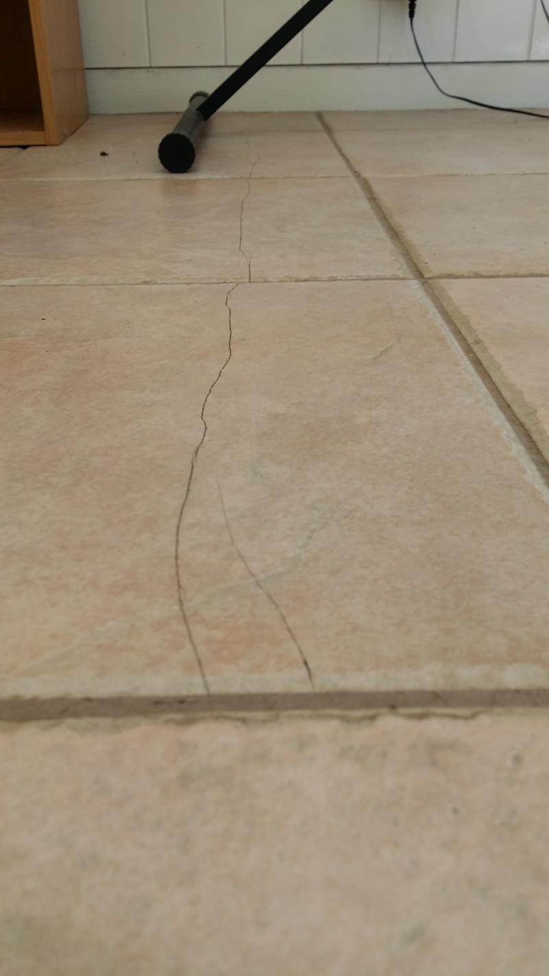 Tiles cracking in a long straight line DIYnot Forums