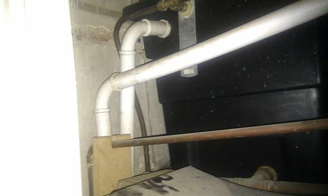 water tank pipework into cupboard