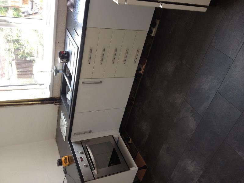 White gloss slab kitchen.